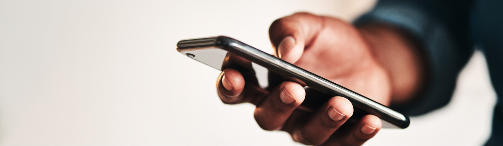 Close up of hands holding a smartphone